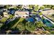 Bird's eye view reveals a property featuring a pool, putting green, sport court and large grassy yard at 6286 S Reseda St, Gilbert, AZ 85298