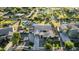 Aerial view of a stunning home with meticulously landscaped grounds, tennis court, and pool at 6286 S Reseda St, Gilbert, AZ 85298