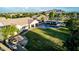Expansive property with swimming pool, lush lawn, outdoor kitchen, and beautiful mountain views at 6286 S Reseda St, Gilbert, AZ 85298