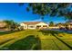 Expansive backyard showcasing lush greenery, manicured landscaping, and covered patio at 6286 S Reseda St, Gilbert, AZ 85298