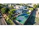 Aerial backyard view of private home featuring a pool, basketball court, built-in barbecue and mature trees at 6286 S Reseda St, Gilbert, AZ 85298