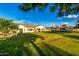 This property is equipped with a huge backyard lawn and an outdoor kitchen at 6286 S Reseda St, Gilbert, AZ 85298