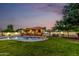 The backyard boasts a swimming pool and outdoor kitchen, perfect for outdoor enjoyment and relaxation at 6286 S Reseda St, Gilbert, AZ 85298