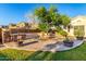 Backyard entertaining area features a brick patio, gas grill, fire pit, and ample seating at 6286 S Reseda St, Gilbert, AZ 85298
