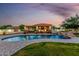 An expansive backyard features a sparkling pool and covered outdoor living area, perfect for leisure at 6286 S Reseda St, Gilbert, AZ 85298