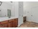 Bright bathroom with double vanities, framed mirrors, and wood cabinets at 6286 S Reseda St, Gilbert, AZ 85298