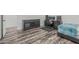 Bedroom boasts a desk and chair, complemented by dark wood flooring and a modern design at 6286 S Reseda St, Gilbert, AZ 85298