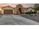Charming single-story home featuring desert landscaping, stone accents, and a porte cochere entryway at 6286 S Reseda St, Gilbert, AZ 85298
