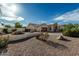 View of a single Gathering home exterior featuring desert landscaping, gated front yard, and courtyard entrance at 6286 S Reseda St, Gilbert, AZ 85298