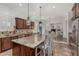 Gourmet kitchen boasts stainless steel appliances, granite counters, and custom cabinets for a luxurious cooking experience at 6286 S Reseda St, Gilbert, AZ 85298