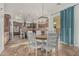 Eat-in kitchen with a round dining table and island with brown cabinets and stainless steel appliances at 6286 S Reseda St, Gilbert, AZ 85298