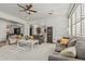 Comfortable living room featuring neutral tones and ample natural light, perfect for gatherings and relaxation at 6286 S Reseda St, Gilbert, AZ 85298