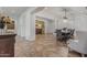 Open concept living room and dining area with high ceilings, natural light, and tile floors at 6286 S Reseda St, Gilbert, AZ 85298
