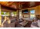 Entertainers patio with built-in grill, covered seating area, fireplace and TV at 6286 S Reseda St, Gilbert, AZ 85298