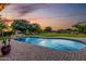 A stunning swimming pool with water feature adds luxury to the expansive backyard at 6286 S Reseda St, Gilbert, AZ 85298