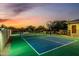 Outdoor tennis court with a basketball hoop adds entertainment to this property at 6286 S Reseda St, Gilbert, AZ 85298
