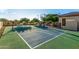 Enjoy a friendly match on this on-property tennis court with a basketball hoop at 6286 S Reseda St, Gilbert, AZ 85298