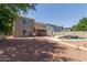 Spacious backyard with covered patio, pool, and lounging area; perfect for outdoor entertaining and relaxation at 634 W Aviary Way, Gilbert, AZ 85233