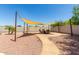 Outdoor patio featuring stylish shaded seating area with a gas firepit at 634 W Aviary Way, Gilbert, AZ 85233