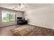This bedroom features a large window, wood-look flooring, and a dedicated workspace at 634 W Aviary Way, Gilbert, AZ 85233