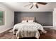 Bright main bedroom with a ceiling fan, plush rugs, and neutral colored decor offers comfort and style at 634 W Aviary Way, Gilbert, AZ 85233