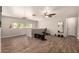 Spacious bonus room with wood floors, a ceiling fan, and bright windows, perfect for recreation and fitness at 634 W Aviary Way, Gilbert, AZ 85233