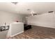 Open bonus room on upper level with hardwood floors and a ceiling fan; a perfect flexible space at 634 W Aviary Way, Gilbert, AZ 85233