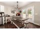 Bright dining area with modern chandelier, exposed aggregate flooring and with natural light at 634 W Aviary Way, Gilbert, AZ 85233