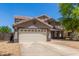 Charming two-story home featuring a desert landscape, a two-car garage and a neutral color palette at 634 W Aviary Way, Gilbert, AZ 85233