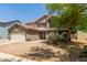 Charming two-story home featuring a desert landscape, a two-car garage and a neutral color palette at 634 W Aviary Way, Gilbert, AZ 85233
