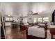 Spacious living room featuring exposed aggregate floor, with modern ceiling fan and a lot of natural light at 634 W Aviary Way, Gilbert, AZ 85233