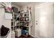 Walk-in pantry providing ample storage space with shelving and a convenient door for easy access at 634 W Aviary Way, Gilbert, AZ 85233