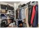 Organized walk-in closet features rods, shelving, and plenty of space for storage at 634 W Aviary Way, Gilbert, AZ 85233