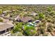 Beautiful aerial view showcasing a backyard pool, patio, and desert landscaping at 7032 E Balancing Rock Rd, Scottsdale, AZ 85266