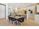 Open-concept kitchen with an island, pendant lighting, and a dining area perfect for Gathering meals at 7032 E Balancing Rock Rd, Scottsdale, AZ 85266
