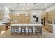 Stylish kitchen with modern appliances, large island with seating, and custom wood cabinetry at 7032 E Balancing Rock Rd, Scottsdale, AZ 85266