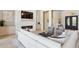 Stylish living room with a stone fireplace, sleek TV, and comfortable seating offering a cozy and inviting atmosphere at 7032 E Balancing Rock Rd, Scottsdale, AZ 85266