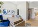 Bright office featuring a plush blue chair, modern decor, and hardwood floors at 7032 E Balancing Rock Rd, Scottsdale, AZ 85266