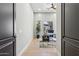 Bright office area with wood floors, a ceiling fan, and outside views at 7032 E Balancing Rock Rd, Scottsdale, AZ 85266