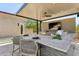 Outdoor kitchen with bar seating, grill, covered area, and desert views at 7032 E Balancing Rock Rd, Scottsdale, AZ 85266