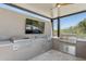 An outdoor kitchen features stainless steel appliances, granite counters and a ceiling fan for comfort at 7032 E Balancing Rock Rd, Scottsdale, AZ 85266