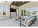 The patio area includes a comfortable seating arrangement and large sliding doors to blend indoor-outdoor living at 7032 E Balancing Rock Rd, Scottsdale, AZ 85266