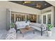 Cozy covered patio with comfortable seating, ceiling fans, and an open view to the indoors at 7032 E Balancing Rock Rd, Scottsdale, AZ 85266