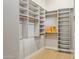 Large walk-in closet with custom shelves and rod space offers ample storage at 7032 E Balancing Rock Rd, Scottsdale, AZ 85266
