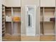 Spacious walk-in closet boasts custom shelving, rods, and a stylish design at 7032 E Balancing Rock Rd, Scottsdale, AZ 85266