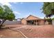 Well-maintained backyard with neutral desert landscaping, patio, and block fence at 7333 N 69Th Ave, Glendale, AZ 85303