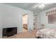Spacious bedroom with ceiling fan, leading to an ensuite bathroom and hallway at 7333 N 69Th Ave, Glendale, AZ 85303