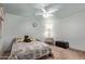 Cozy bedroom featuring a ceiling fan, neutral carpet, and comfortable furnishings at 7333 N 69Th Ave, Glendale, AZ 85303