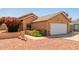 Inviting home exterior with desert landscaping, a two-car garage, and an attractive stucco facade at 7333 N 69Th Ave, Glendale, AZ 85303