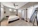 Bright bedroom featuring a cozy bed, ceiling fan, large window, and stylish decor at 7857 N 21St Ave, Phoenix, AZ 85021